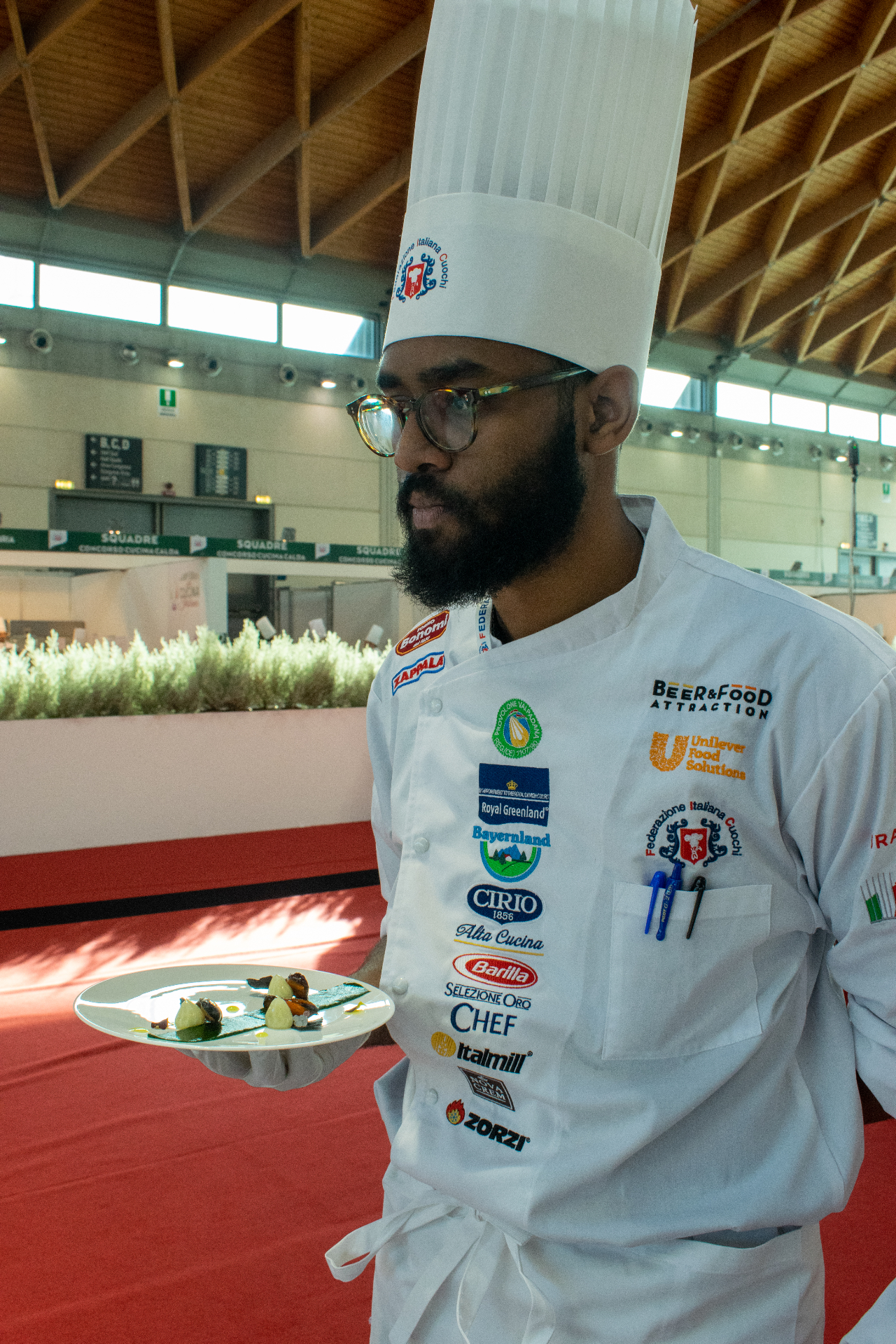 Chef Myles plating at Campionati della Cucina Italiana