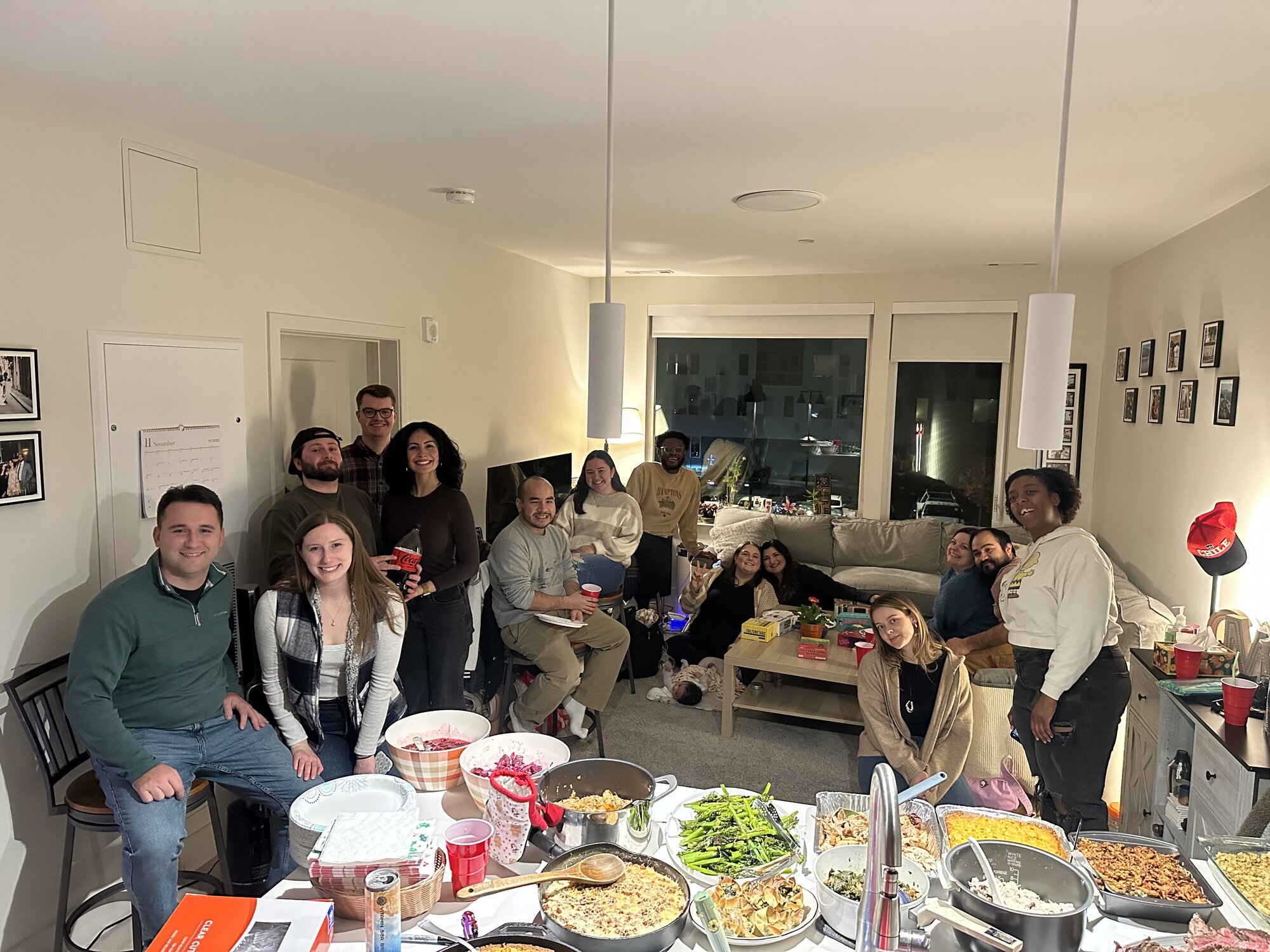 Friendsgiving feast surrounded by guests